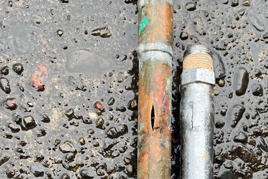 A broken copper and metal pipe from pipe replacement. 